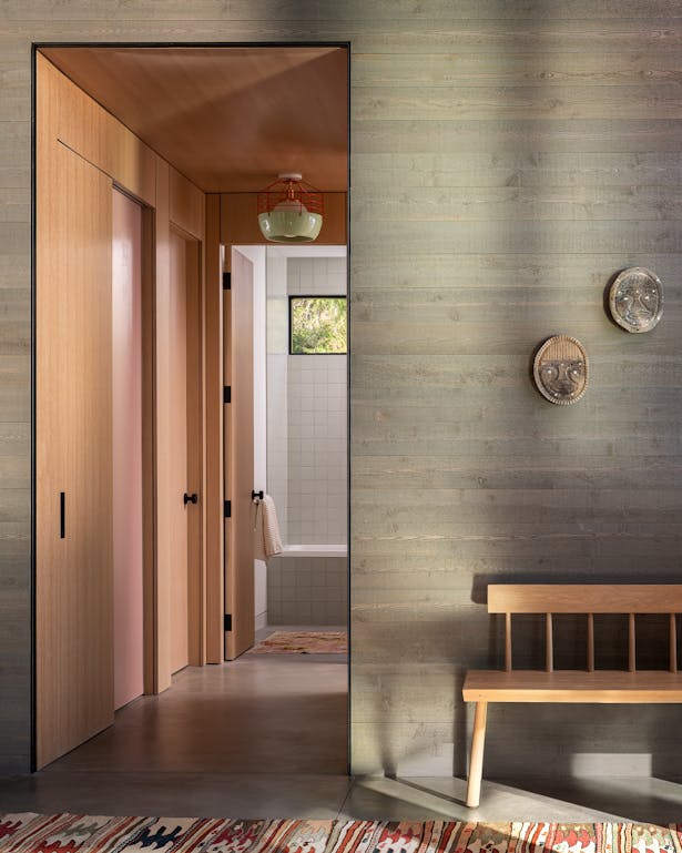 Locally-sourced cedar siding continues from exterior through the interior, emphasizing the indoor/outdoor lifestyle encouraged by the natural beauty of the area. Andrew Pogue Photography