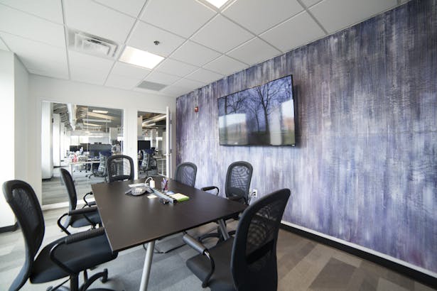 Deepfield conference room with painting by Taduesz Bazydlo.