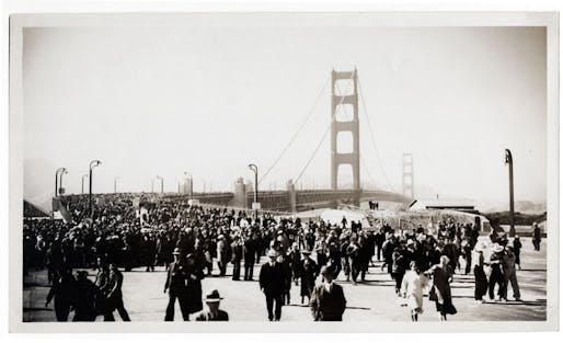 In 1933, the Standard Oil Company sent employee Ted Huggins to photograph the bridge's construction. Huggins visited the site weekly for three years and produced hundreds of photographs, which he offered to news outlets covering the project. Huggins took this picture on the bridge's opening day on...