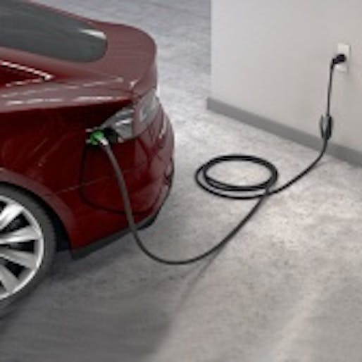 Plugged in: A Tesla Model S recharges at a standard outlet. (Image via technologyreview.com)