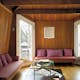 The third floor contains a sitting room with built-in sofas. Annie Schlechter