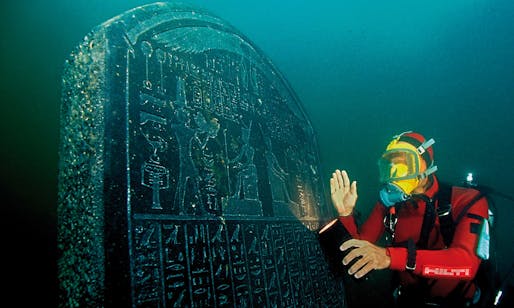 A diver with a large tablet carrying a royal decree from the pharaoh Nectanebo I, which will feature in the British Museum exhibition. Photograph: Christoph Gerigk/Franck Goddio/Hilti Foundation. Photo via theguardian.com.