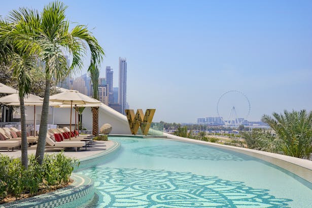 Overlooking the city icons including Ain Dubai by the pool 