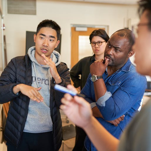 Cory Henry (right) works with students in WashU's Sam Fox School during the 2023 Fitzgibbon charrette in the College of Architecture. Photo: Devon Hill / Washington University.