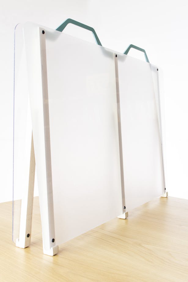 36' Workwall in frosted acrylic, birch plywood legs, and blue steel handle.