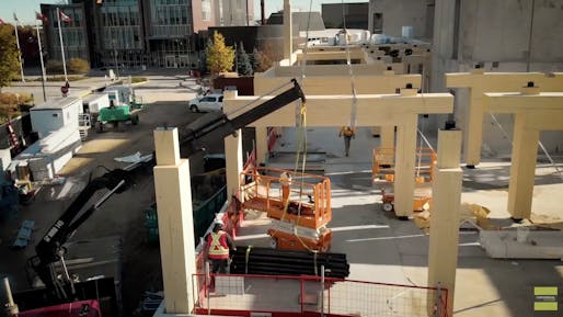 The new mass timber A-Block Expansion Building from Dialog for Centennial College. Image still from Mass Timber Installation via Centennial College Youtube page.