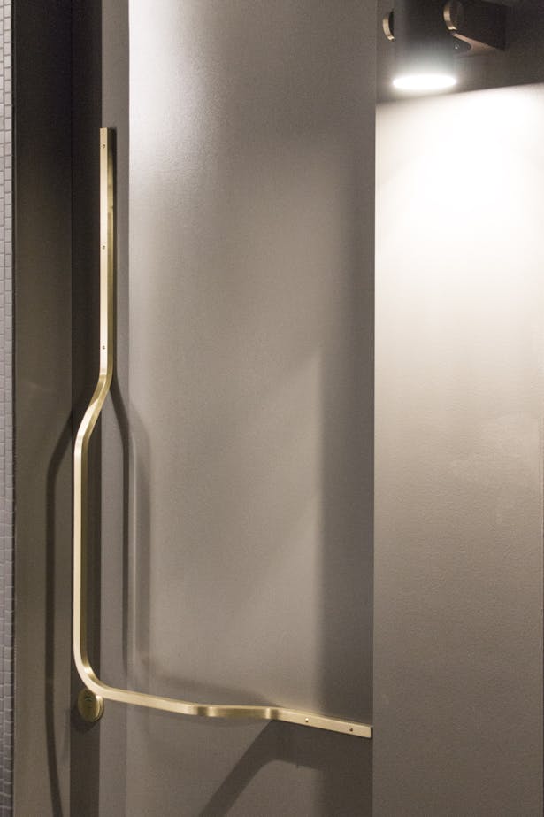 Nightcap by Synecdoche Design - restroom door handles in brass