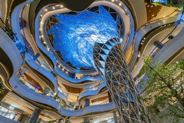 A cascading funnel in the main atrium, serving as a canvas for a 360-degree light show