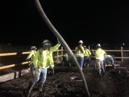 'Under the natural shade of the moon:' construction workers in a Phoenix suburb pour concrete at 1 a.m. when temperatures have finally dropped to the high 80s and make the material more manageable. (Photo: Sarah Ventre/KJZZ; Image via npr.org)