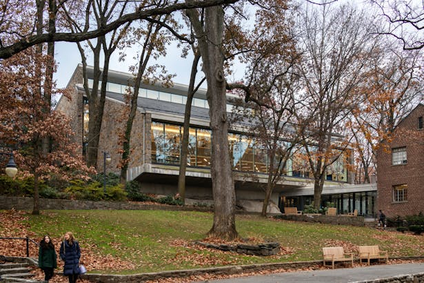 Maintaining the integrity of the original stone and concrete building, the exterior renovation includes new windows with “bird-friendly” glazing and a new main entrance facing the campus quadrangle. © James Ewing