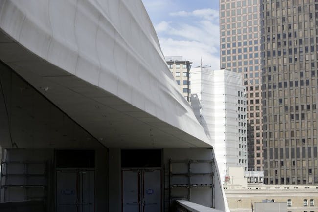 The lines of the new exterior of the San Francisco Museum of Modern Art is contrasted with other buildings in downtown San Francisco (photo by Lea Suzuki, The SF Chronicle)