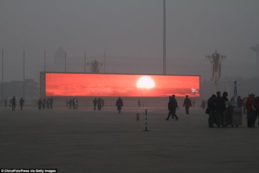 A video of a sunrise played on an screen in Beijing. Credit: ChinaFotoPress via Getty Images