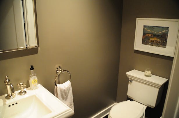 The new powder room developed from the extra hallway space. 