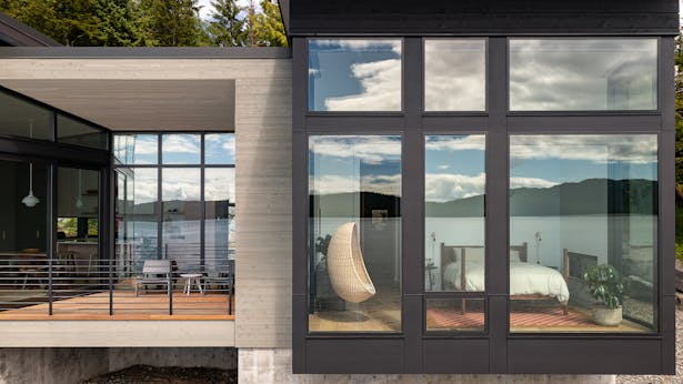 While the landward side of the house has fewer openings to create privacy, the seaward side uses floor-to-ceiling glazing to emphasize living on the water. Andrew Pogue Photography
