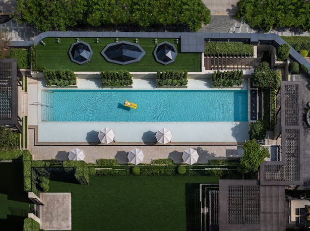 Outdoor Pool Deck and Roof Garden Feature Echoing the Architectural Language
