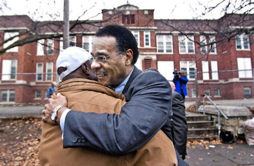 Before a Monday news conference at the Bancroft School site, Rep. Emanuel Cleaver embraced Mike Richardson, who lives near the school. 