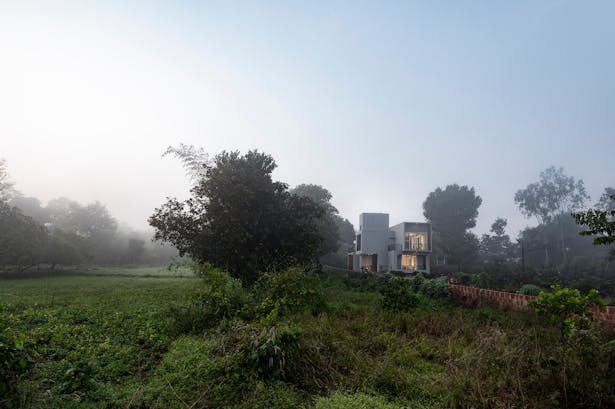  View from the fields: The architectural concept of this house was creating outward looking frames in every direction savoring in the beauty of nature around.