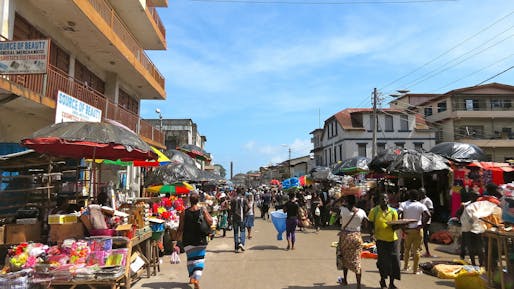 Local market street in Freetown, Sierra Leone. Image <a href="https://commons.wikimedia.org/wiki/File:Freetown_street_(13992704238).jpg">by Erik Cleves Kristensen via Wikipedia Creative Commons (CC BY 2.0)</a>