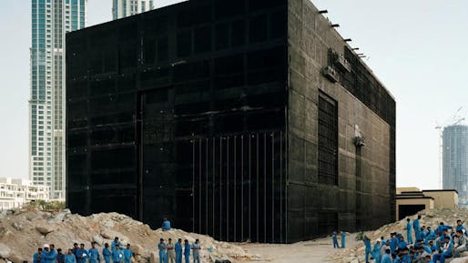 Bas Princen coolly eyes a cooling plant being built in Dubai in 2009. Beyond, more construction. (via latimes.com; Photo: Bas Princen / Barbican Art Gallery)