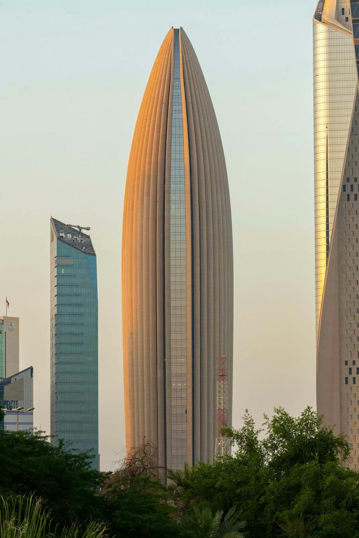 Foster + Partners complete Kuwait skyscraper with curving concrete fins
