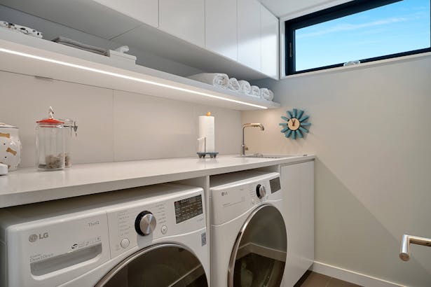 A welcoming laundry room is light-filled. Credit: Brian Bailey