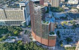 Skanska and BIG complete curving terracotta-colored tower in Houston