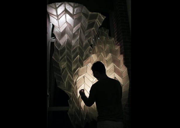 Designed by Felecia Davis, the "Responsive Phototropic Fiber Composite Structure" is a foldable, reconfigurable lightweight structure that senses and provides background light as shown at the Textile Intersections Exhibition at Loughborough University in London, England in 2019. Team: J.D. Ajayi, J. Huang, K. Kuo, I. Pun, Z. Hanzakian. Credit: Felecia Davis. 