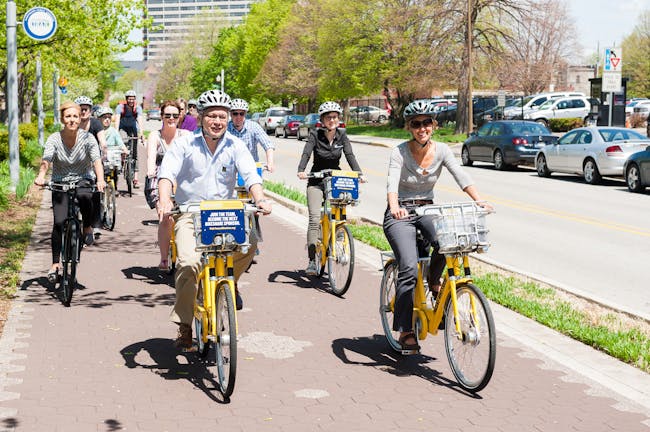 Atlanta Public Works Commissioner Richard Mendoza and Denver Transportation Director Crissy Fanganello join other top transportation officials for a bike ride on Indianapolis' protected bike lane the Cultural Trail during the Green Lane Project kickoff event today. Photo credit: PeopleForBikes Green Lane Project