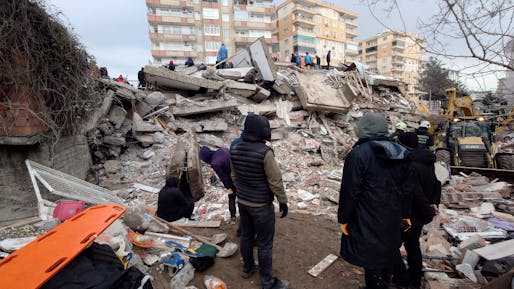 A collapsed building in Diyarbakır, Turkey on February 6. Image courtesy of Voice of America (Public Domain).