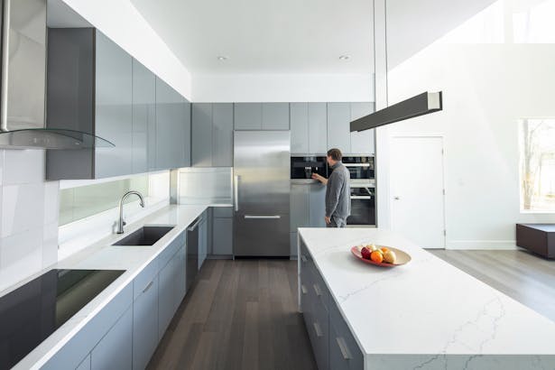 Clean, reductive design in the open kitchen.