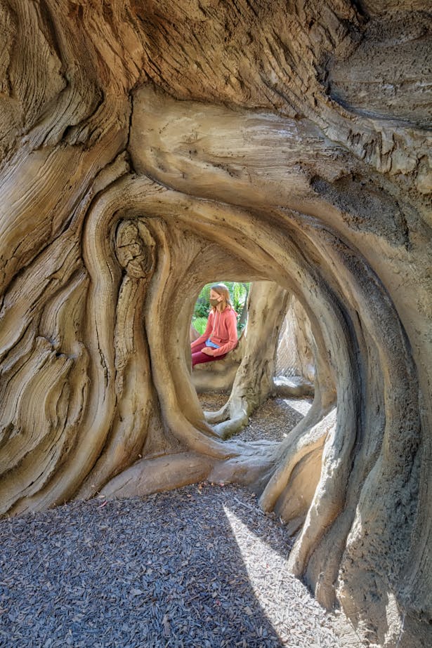 Kids exploring underneath The Treehouse. Photo credit: Marco Zecchin Photography