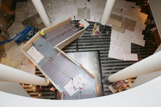 The new staircase undergoes work at the San Francisco Museum of Modern Art (photo by Lea Suzuki, The SF Chronicle)