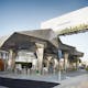Photo of a LEED-certified BP petrol station. Its sustainability features include green roofs, solar panels, energy-efficient lighting, and the reuse of the kiosk from the previous petrol station.The newly-built canopy consists of 1,653 stainless steel panels. Project: Helios House Petrol Station...