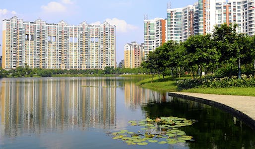 Modern luxury residential buildings stand lakeside in Foshan, in the Chinese province of Guangdong. (via urbanland.uli.org)
