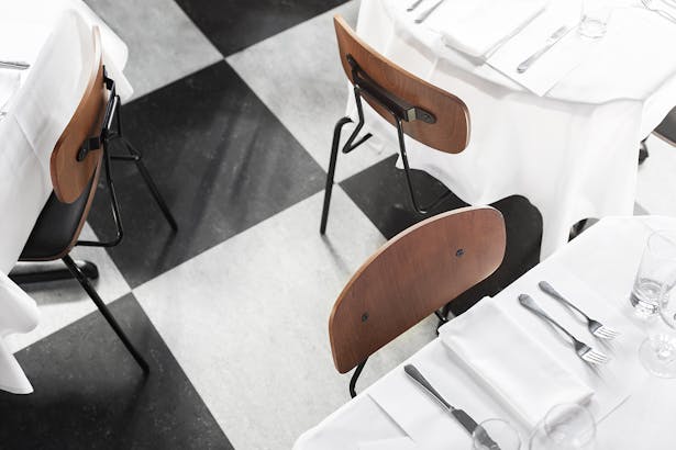 A new black&white floor in the main dining room hearkens back to a traditional Italian trattoria.