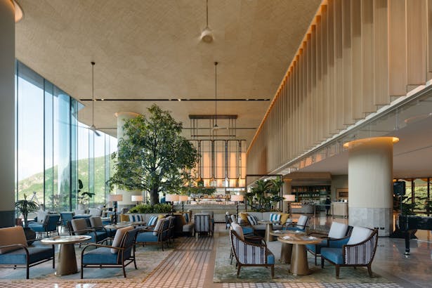 Double-height glass brings ample sunlight to the lobby 