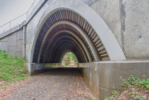 As one of a few composite arch bridges that have been built in the U.S., this structure in Lagrange, Maine spans 36 feet using 13 light-weight carbon fibre tubes. (Image: Advanced Structures & Composites Center at the University of Maine)