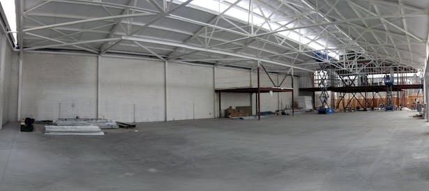 Construction interior of naturally-lit manufactory space.