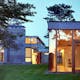 The Rifkind House in Wainscott, NY, a Long Island Modernist triptych pavilion clad in warm cedar siding, balanced with cool New York bluestone. Mahogany floor-to-ceiling window frames and custom-designed cherrywood furniture make the house an inviting and convivial entry into the pantheon of...