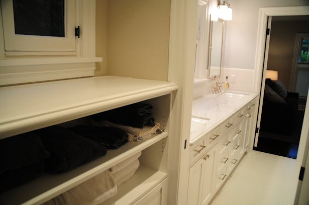 A closet was shifted to create a vestibule into a new Jack-&-Jill bathroom.