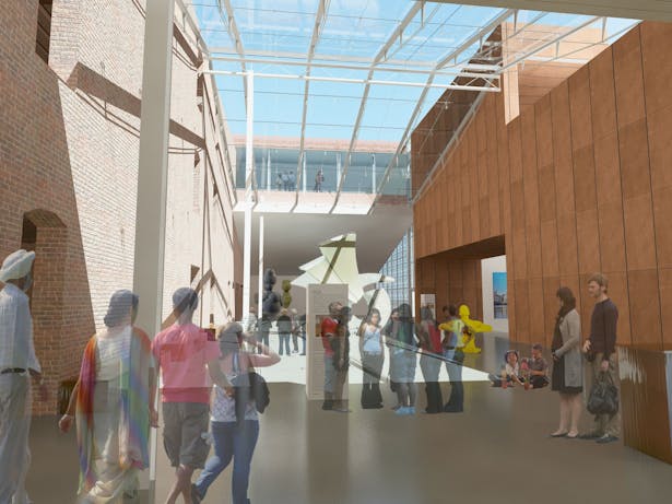 The void between old and new, acting as the entry lobby. The library skyway can been seen through the glass skylight.