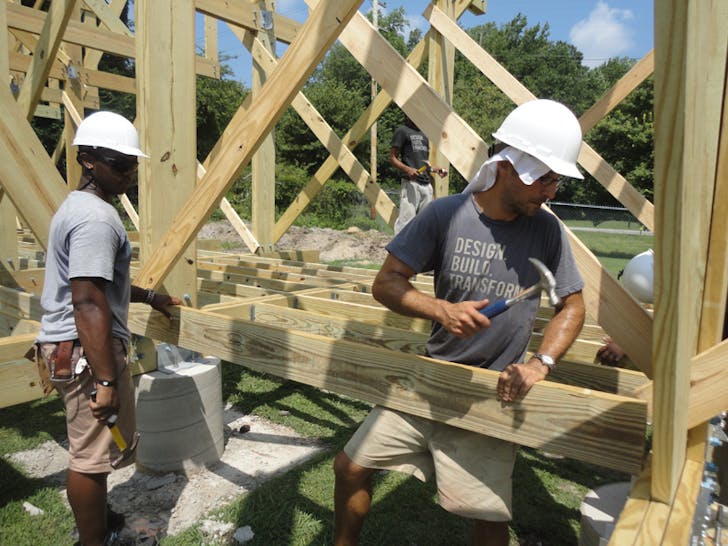 Studio H student Erick Bowen and instructor Matthew Miller work on constructing the Windsor Farmers Market pavilion. From IF YOU BUILD IT, a Long Shot Factory Release 2013.
