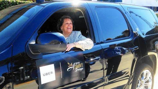 Altamonte Springs Mayor Patricia Bates sits at the wheel of an Uber vehicle at City Hall after announcing the new partnership between her city and the ride-sharing company on Friday. (Martin Comas, via Orlando Sentinel)