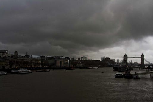 Dark clouds gather over Canary Wharf and Tower Bridge. Image for Rex Features via independent.co.uk