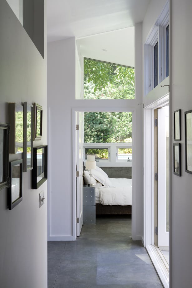 A new master bedroom suite was added to the rear of the home and designed around a new exterior courtyard area that connects to the larger living room patio. 