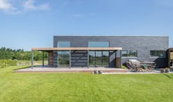 Sustainable slate tiles dress this Danish family’s energy-efficient “Future House”