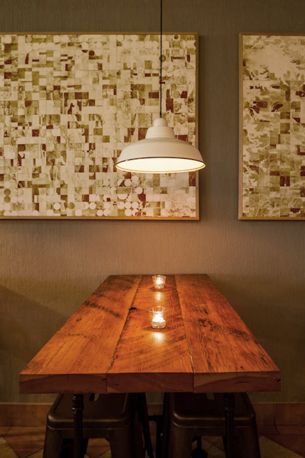 reclaimed wood + plumbing pipe tables, © 2012 Guy Wilkinson; artwork, © Ashley Couch