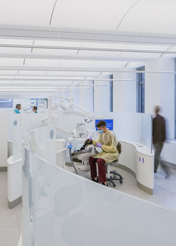 The design of The Center for Precision Dental Medicine at the 5th floor of the Vanderbilt Clinic is an inventive reinterpretation of the spaces within the original 1928 building, designed by James Gamble Rogers. An open, loft-like space with plentiful daylight and low translucent partitions provides unobstructed views throughout the clinic and to the outside. Vaulted ceilings and raised floors integrate indirect lighting, air, medical services and data distribution.