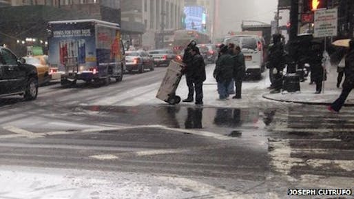 This photo taken by the Tri-State Transportation Campaign shows pedestrians standing in a snowy neckdown created in New York's most recent snow storm