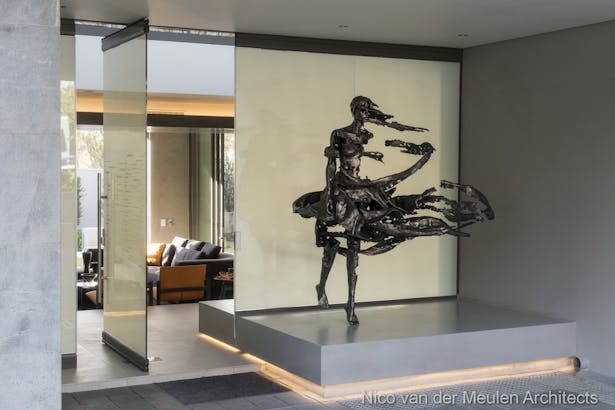 Sculpture by Regardt van der Meulen at entrance in front of privacy glass